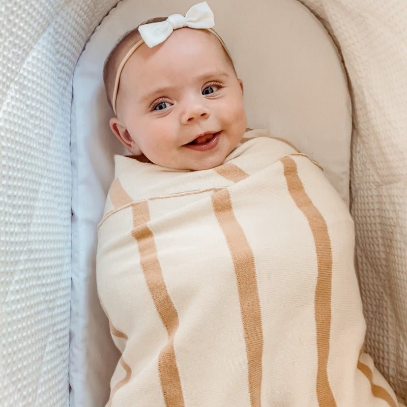Snuggly Jacks knitted blanket in beige and brown stripes, made of organic cotton and measuring 100 cm x 120 cm