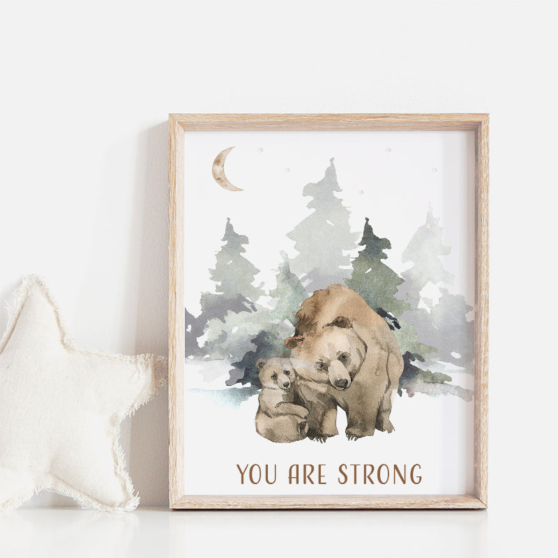 Wooden framed picture of a bear with its cub in a forest