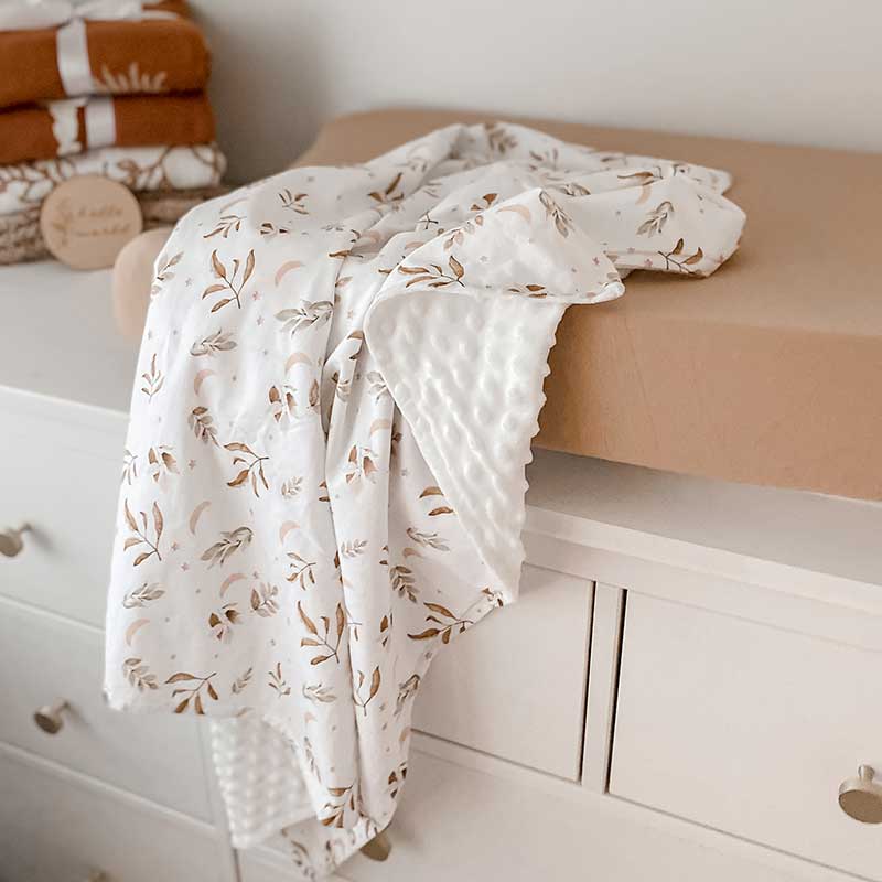 Baby Change Table with a Snuggly Jacks Camel change mat cover and Twilight Minky Blanket Draped over the change pad